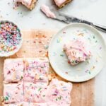 Cake Batter Blondies topped with frosting and sprinkles
