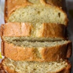 Front view of a lemon poppy seed pound cake cut into slices.