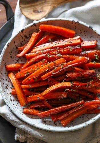 Roasted carrots in a bowl topped with parsley
